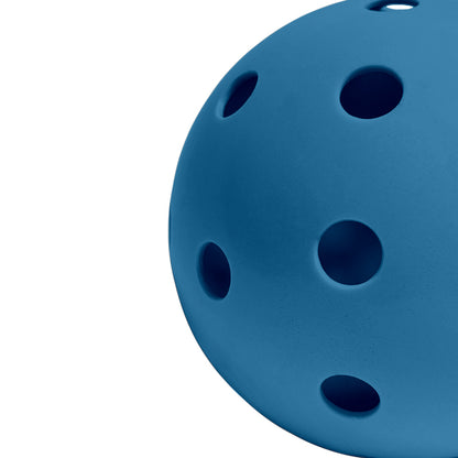 Perforated Surface of Blue Pickleball Against a White Background