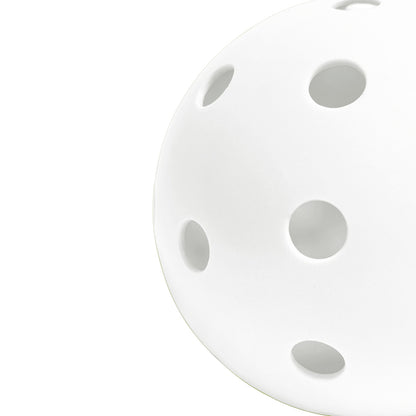 Perforated Surface of White Pickleball Against a White Background